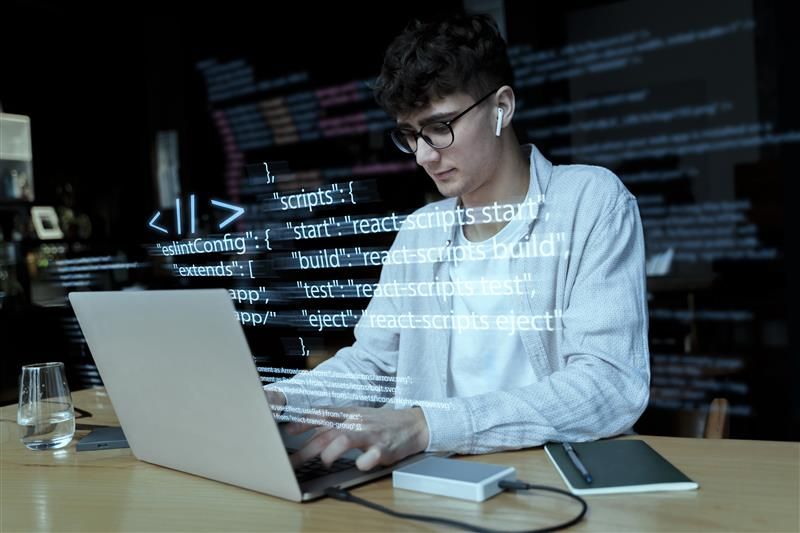 programming-background-with-person-working-with-codes-computer.jpg
